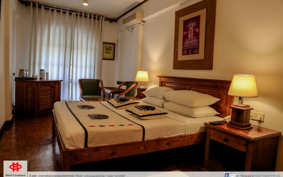 a hotel room with a bed and a desk